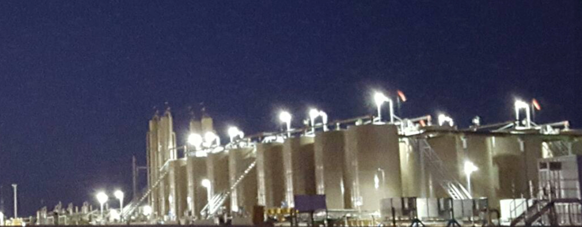 building factory with lights at night odessa tx